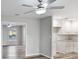 A combined space with plank flooring, access to a kitchen, and natural light at 632 Oakhurst St, Altamonte Springs, FL 32701