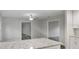 Open-concept living area with granite island, bright paint, and plank floors at 632 Oakhurst St, Altamonte Springs, FL 32701