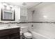 Updated bathroom with white marble tile and modern vanity at 1000 S Semoran Blvd # 814, Winter Park, FL 32792