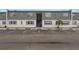 Two-story building exterior with gray siding and ample parking at 1000 S Semoran Blvd # 814, Winter Park, FL 32792