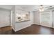 Open concept living room with kitchen pass through and dark floors at 1000 S Semoran Blvd # 814, Winter Park, FL 32792