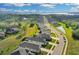 An aerial view of a neighborhood with beautiful homes and a pond, offering a serene and picturesque setting at 10157 Spring Lake Dr, Clermont, FL 34711