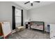 ' bedroom with crib, easel, dresser, and window with black-out curtains at 10157 Spring Lake Dr, Clermont, FL 34711
