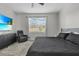Bedroom featuring television, recliner chair, carpet and neutral paint at 10157 Spring Lake Dr, Clermont, FL 34711