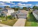 Single-Gathering home with gray siding and two-car garage at 10157 Spring Lake Dr, Clermont, FL 34711