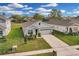 Single-Gathering home with gray siding and two-car garage at 10157 Spring Lake Dr, Clermont, FL 34711