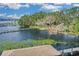Aerial shot overlooking the lake with dock and shoreline at 10157 Spring Lake Dr, Clermont, FL 34711
