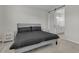 Comfortable bedroom with barn door leading to the ensuite bathroom at 10157 Spring Lake Dr, Clermont, FL 34711