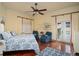 Bedroom with a blue and white comforter and hardwood floors at 12540 Park Avenue, Windermere, FL 34786