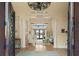 Bright and spacious entryway with high ceilings and elegant light fixture at 12540 Park Avenue, Windermere, FL 34786