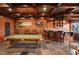 Game room boasts a pool table, wet bar, and wood-paneled walls at 12540 Park Avenue, Windermere, FL 34786