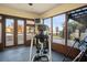 Home gym with elliptical and lake views at 12540 Park Avenue, Windermere, FL 34786
