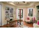 Bright home office features built-in shelves and lake views at 12540 Park Avenue, Windermere, FL 34786
