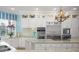 Modern kitchen with ample counter space and stylish light fixtures at 12540 Park Avenue, Windermere, FL 34786