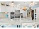 Gourmet kitchen with stainless steel appliances and white cabinets at 12540 Park Avenue, Windermere, FL 34786