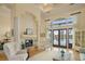 Large living room with a fireplace, plenty of natural light and lake view at 12540 Park Avenue, Windermere, FL 34786
