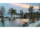 Expansive pool area overlooking the lake with dock access at 12540 Park Avenue, Windermere, FL 34786