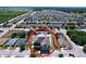 Aerial view of a home with gravel backyard, shed, swing, and fire pit in a residential neighborhood at 1727 Wood Path, Auburndale, FL 33823