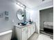 This elegant bathroom has a dual sink vanity with granite counters and vessel sinks at 1727 Wood Path, Auburndale, FL 33823