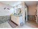 Stylish bathroom featuring double glass vessel sinks, tile accents, and modern fixtures and lighting at 1727 Wood Path, Auburndale, FL 33823