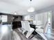 Open-concept dining area with stylish furniture, lighting, and adjacent living room perfect for entertaining and comfort at 1727 Wood Path, Auburndale, FL 33823