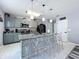 Beautiful kitchen featuring a center island with barstool seating, stainless appliances and modern cabinetry at 1727 Wood Path, Auburndale, FL 33823