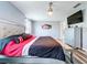 Spacious primary bedroom featuring sleek flooring, a ceiling fan, and a comfortable seating area at 1727 Wood Path, Auburndale, FL 33823