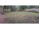 Large backyard with a wooden fence at 1859 Lake Hill Cir, Orlando, FL 32818