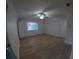 Spacious bedroom featuring wood-look flooring, neutral walls, and a ceiling fan at 1859 Lake Hill Cir, Orlando, FL 32818