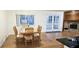 Bright dining room featuring a wooden table with six chairs and access to a patio at 1859 Lake Hill Cir, Orlando, FL 32818