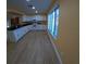 Updated kitchen with white cabinets, tile flooring, and modern appliances at 1859 Lake Hill Cir, Orlando, FL 32818