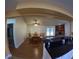 Open layout of the dining and living area, featuring a fireplace and an adjacent kitchen at 1859 Lake Hill Cir, Orlando, FL 32818