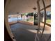 Enclosed patio with an airy feel, offering views of the backyard and a separate storage shed at 1859 Lake Hill Cir, Orlando, FL 32818