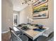 Elegant dining room with stylish table setting and modern chandelier at 244 Villa Domani Cir, Davenport, FL 33896