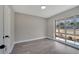 Spacious bedroom with large window and wood-look flooring at 2509 Healy Dr, Orlando, FL 32818