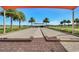 Bocce ball court with shading, landscaping, and views of the surrounding area at 440 Alcove Dr, Groveland, FL 34736