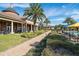 Lush grounds and manicured landscaping lead to the clubhouse at 440 Alcove Dr, Groveland, FL 34736