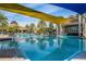 Expansive community pool with seating, covered areas, and manicured grounds at 440 Alcove Dr, Groveland, FL 34736