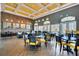 Spacious community restaurant with modern decor, comfortable seating, and stylish lighting at 440 Alcove Dr, Groveland, FL 34736