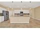 Kitchen island with granite countertops and stainless steel appliances against a backsplash and pendant lighting at 440 Alcove Dr, Groveland, FL 34736