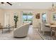 Open living area with sliding glass doors to the patio, adjacent to the dining space at 440 Alcove Dr, Groveland, FL 34736