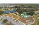 Aerial view of neighborhood amenities including tennis courts, bocce ball, playground and parking at 513 San Sebastian Ct, Davenport, FL 33837