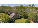 Aerial view of home showing the large lot with mature trees providing ample backyard privacy at 513 San Sebastian Ct, Davenport, FL 33837