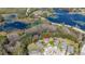 Aerial view of home in cul-de-sac, backing up to a large pond, and close to nearby shopping at 513 San Sebastian Ct, Davenport, FL 33837