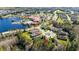 Gorgeous aerial view of community homes, a community pool and lake with dock at 513 San Sebastian Ct, Davenport, FL 33837