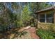 Home exterior with a view of the wooded backyard with mature trees and view of the pond at 513 San Sebastian Ct, Davenport, FL 33837