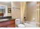 Bathroom featuring a tiled shower/tub combo and cherry vanity with granite countertops at 513 San Sebastian Ct, Davenport, FL 33837