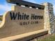 A large stone sign identifies the White Heron Golf Club community entrance at 513 San Sebastian Ct, Davenport, FL 33837