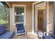 Relaxing covered patio featuring comfortable seating, privacy, and outdoor living space at 513 San Sebastian Ct, Davenport, FL 33837