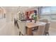 Elegant dining area with stylish furnishings and plenty of natural light at 513 San Sebastian Ct, Davenport, FL 33837